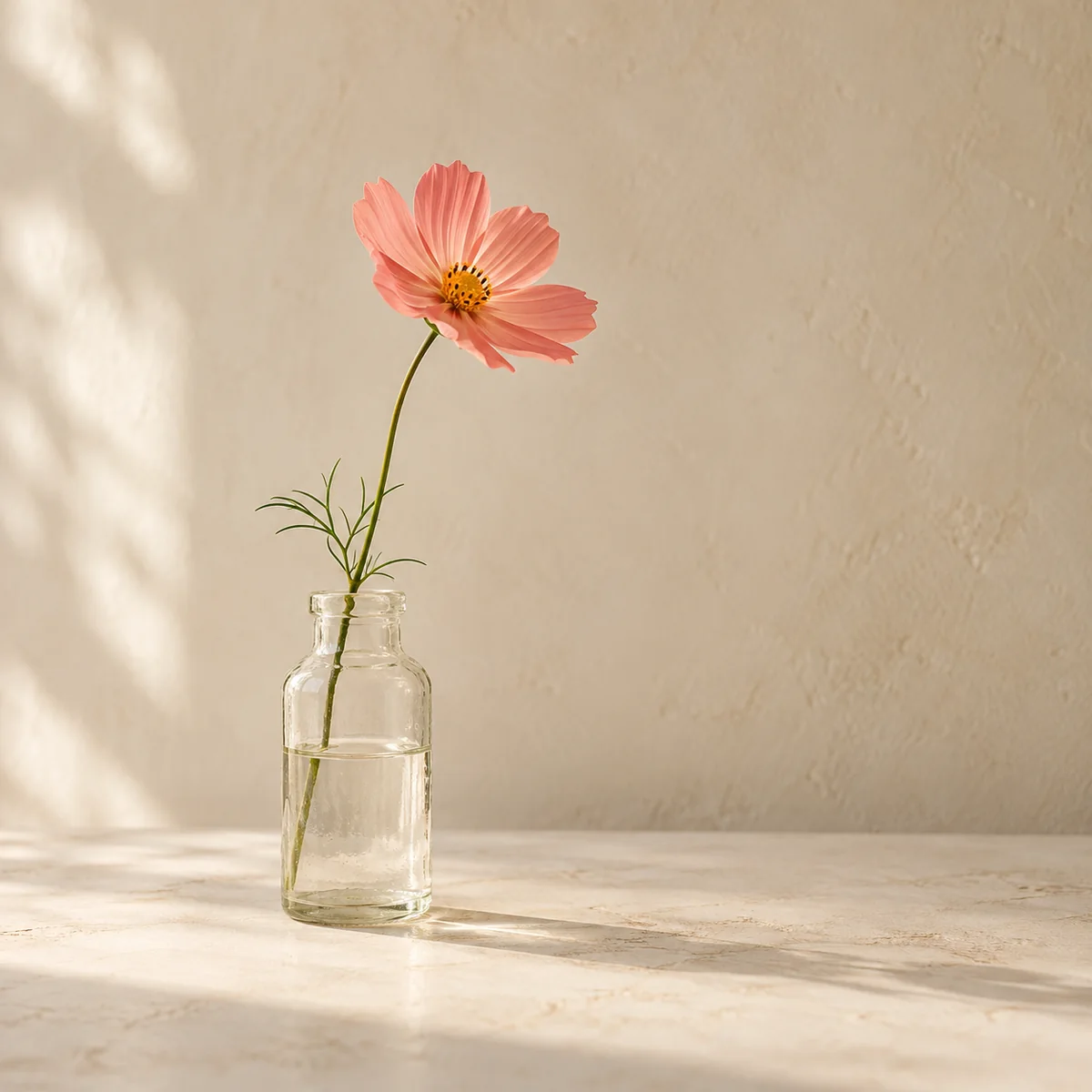 Single stem in a small glass bottle